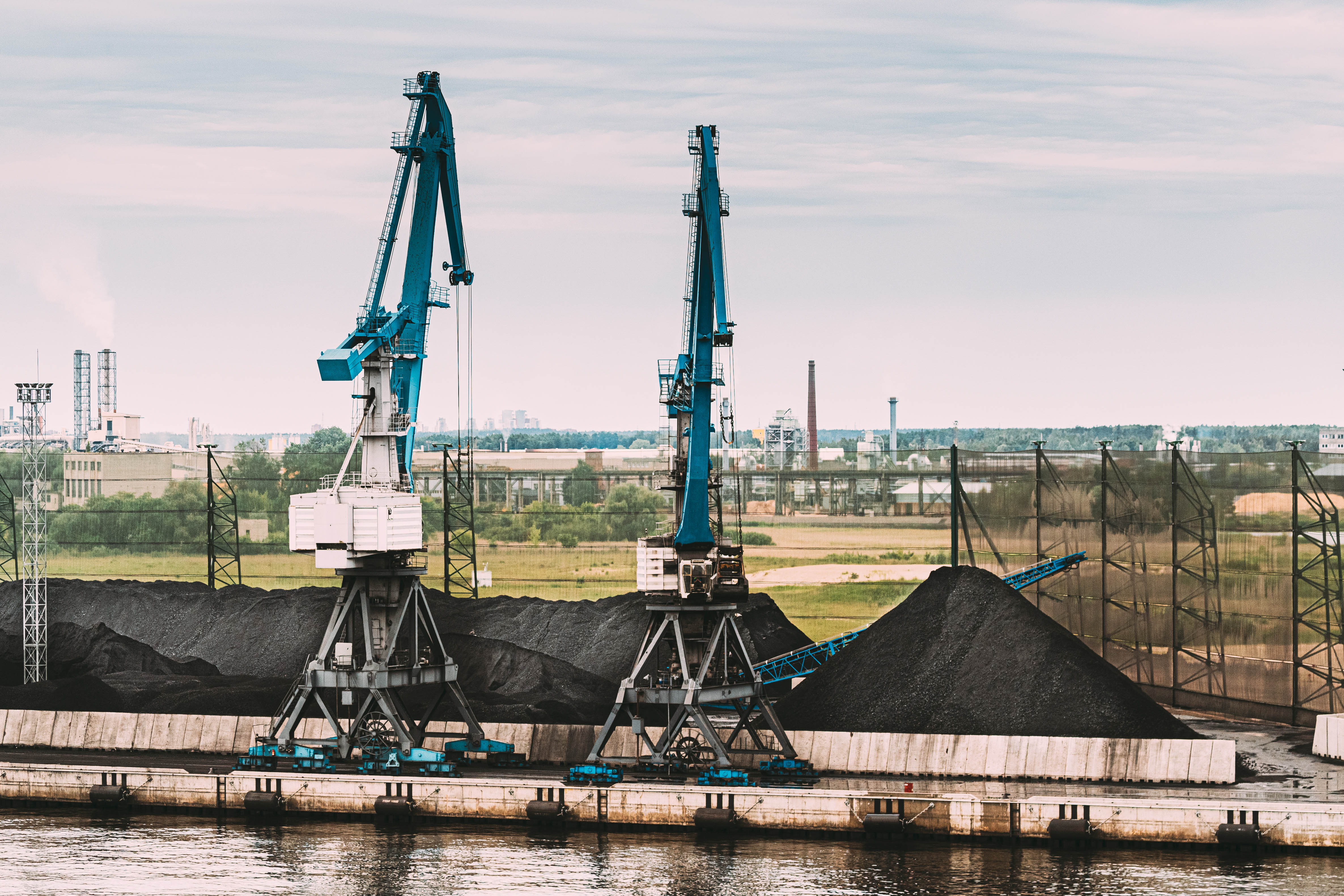 Coal Production, Cranes And Coal Loading At The Port Terminal. Industrial Port Terminal.